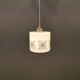 Scandinavian hanging lamp in white glass with inlayed black motifs.