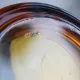 Vintage Italian round ashtray in thick amber glass – Ø 15 cm