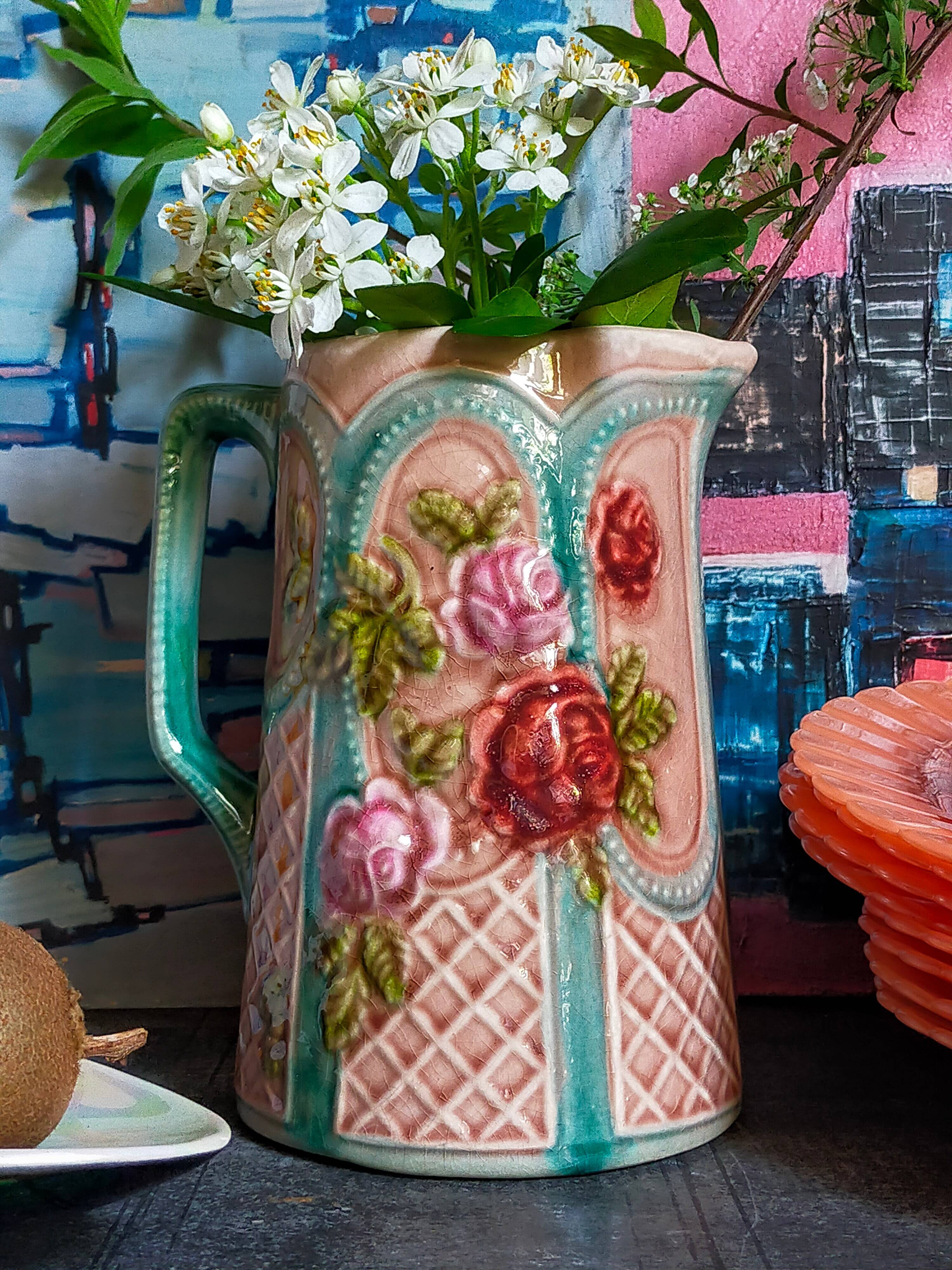 Antique slip pitcher with blooming roses