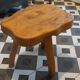Brutalist tripod stool in solid elm