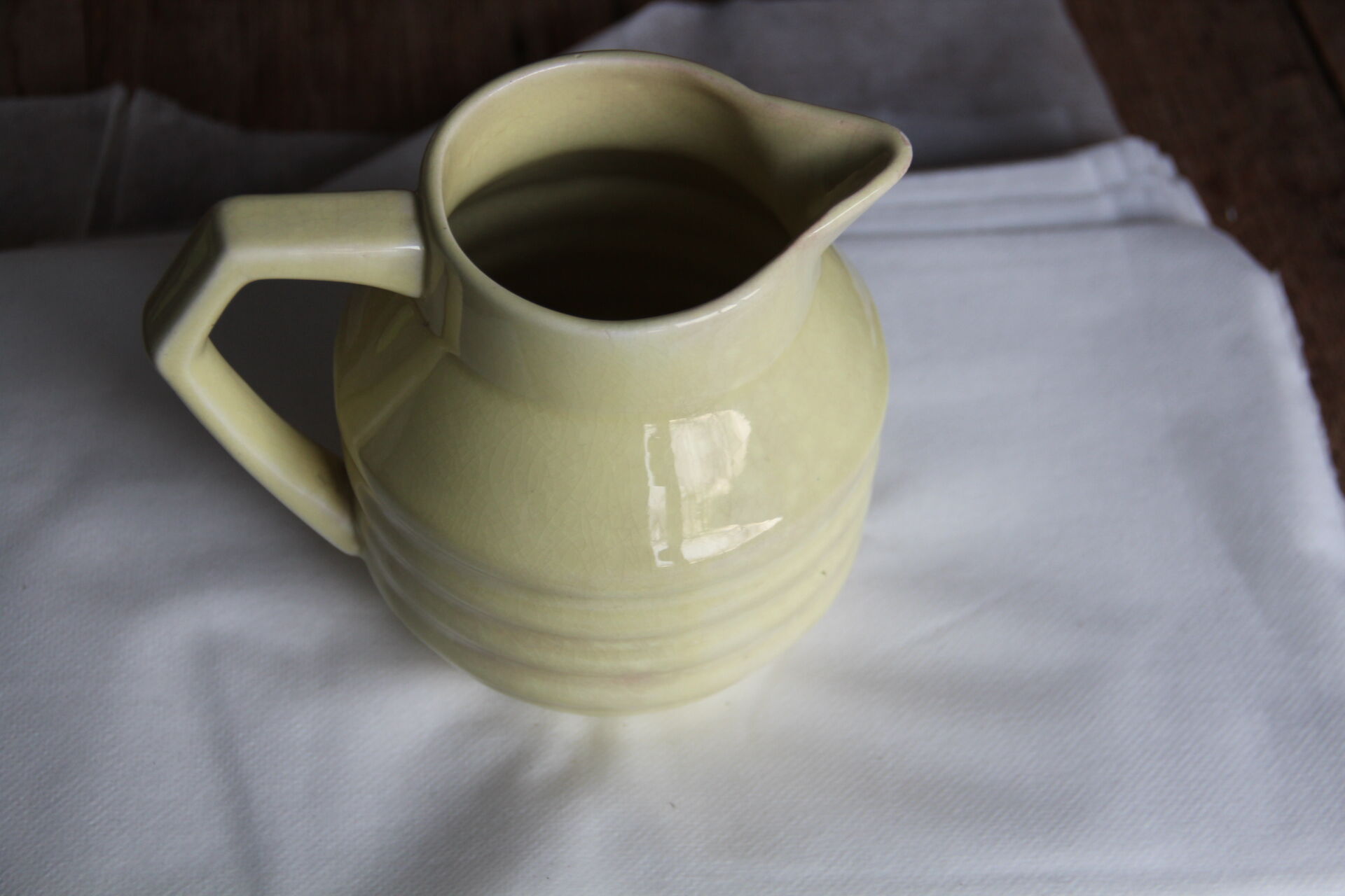Art-deco pitcher in pale yellow earthenware