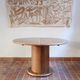 Round table with a central pedestal, light wood, 1990s.