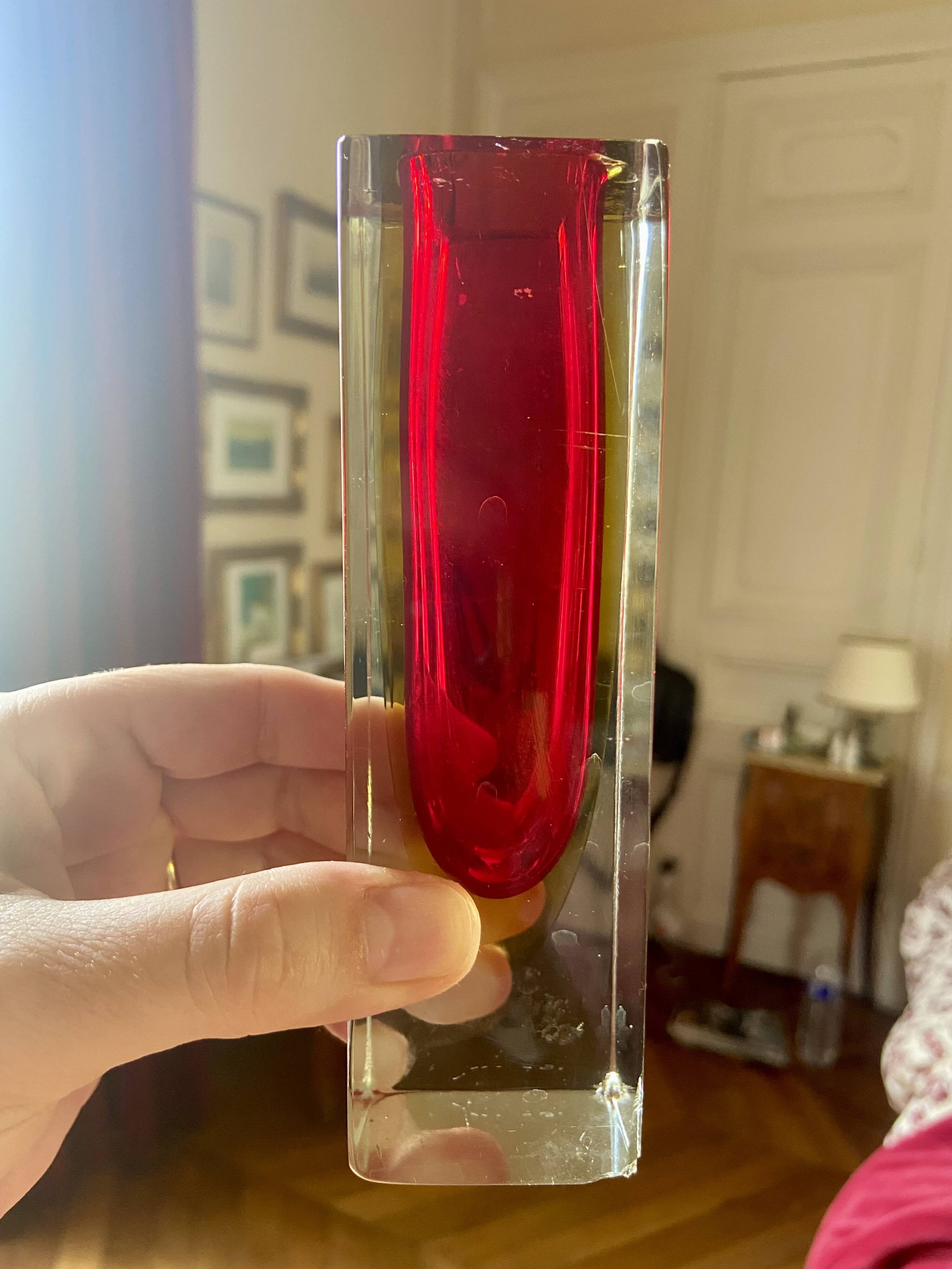 Small red vase made of Murano glass.
