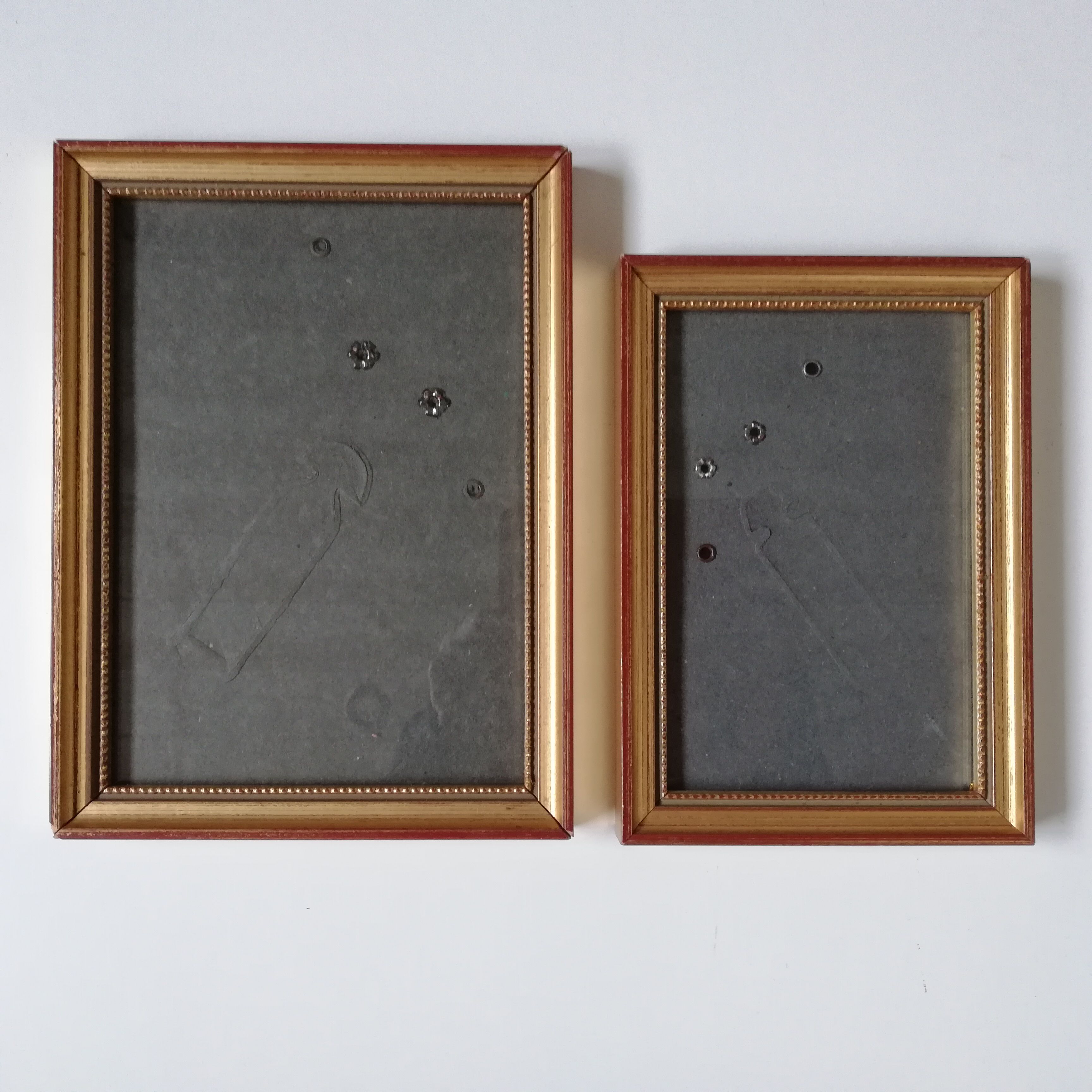 Pair of photo frames under glass, gilded wood