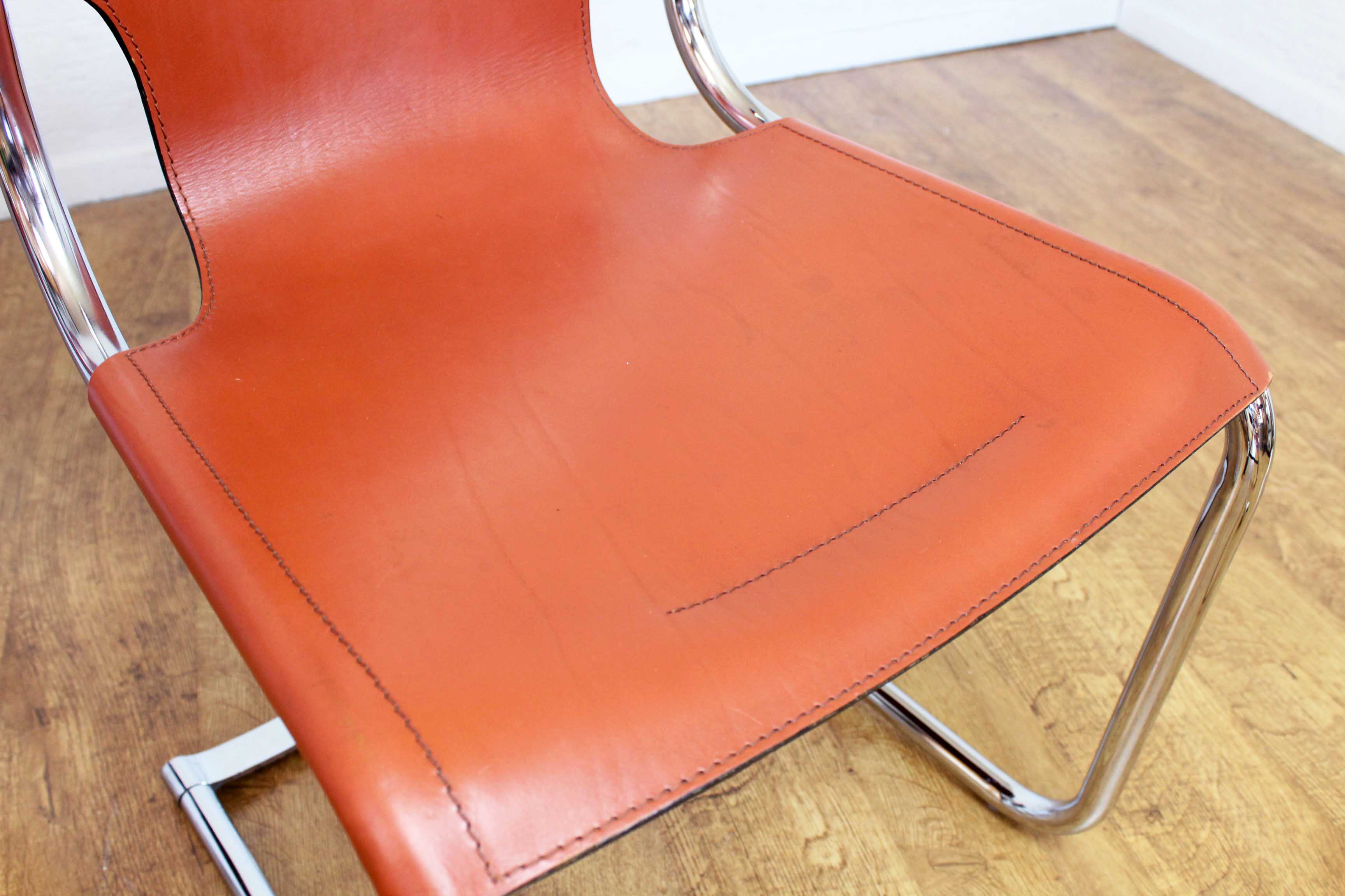 Pair of chairs in leather and chrome tube
