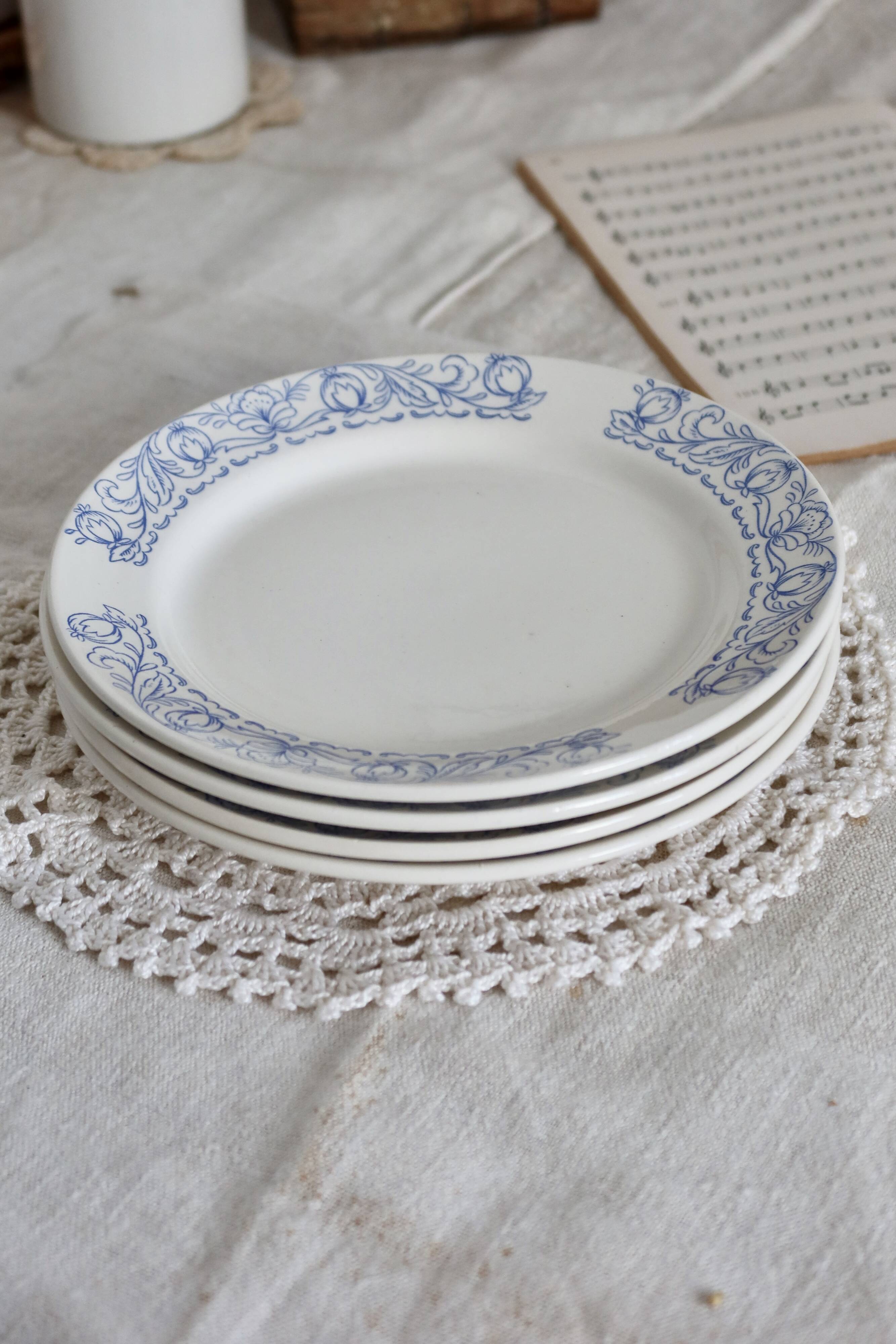 4 vintage porcelain dessert plates with blue border