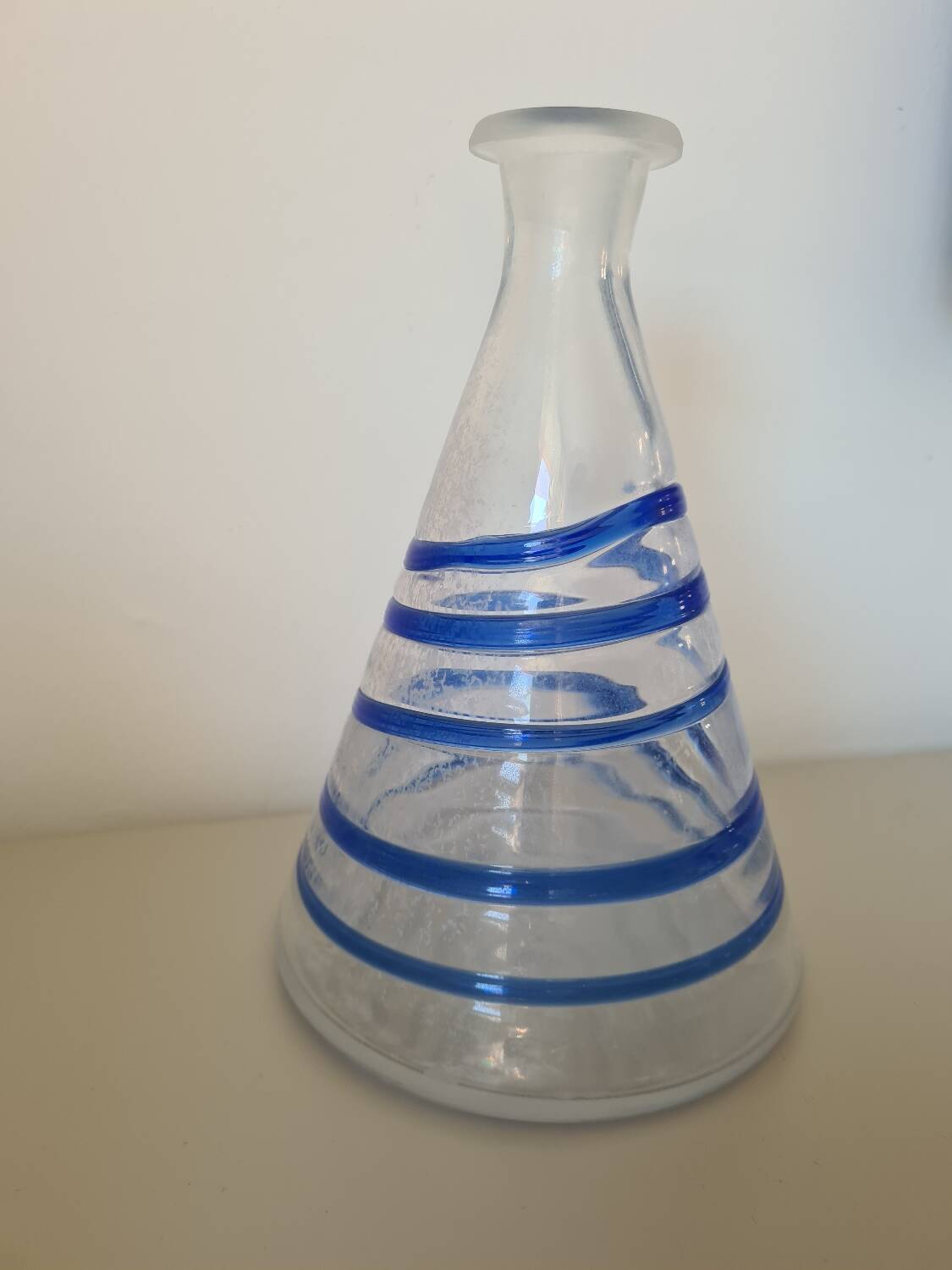 Conical glass vase/carafe blown with a blue spiral decoration.
