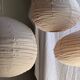 Large round pink Japanese-style suspension made of rattan and natural linen D60.