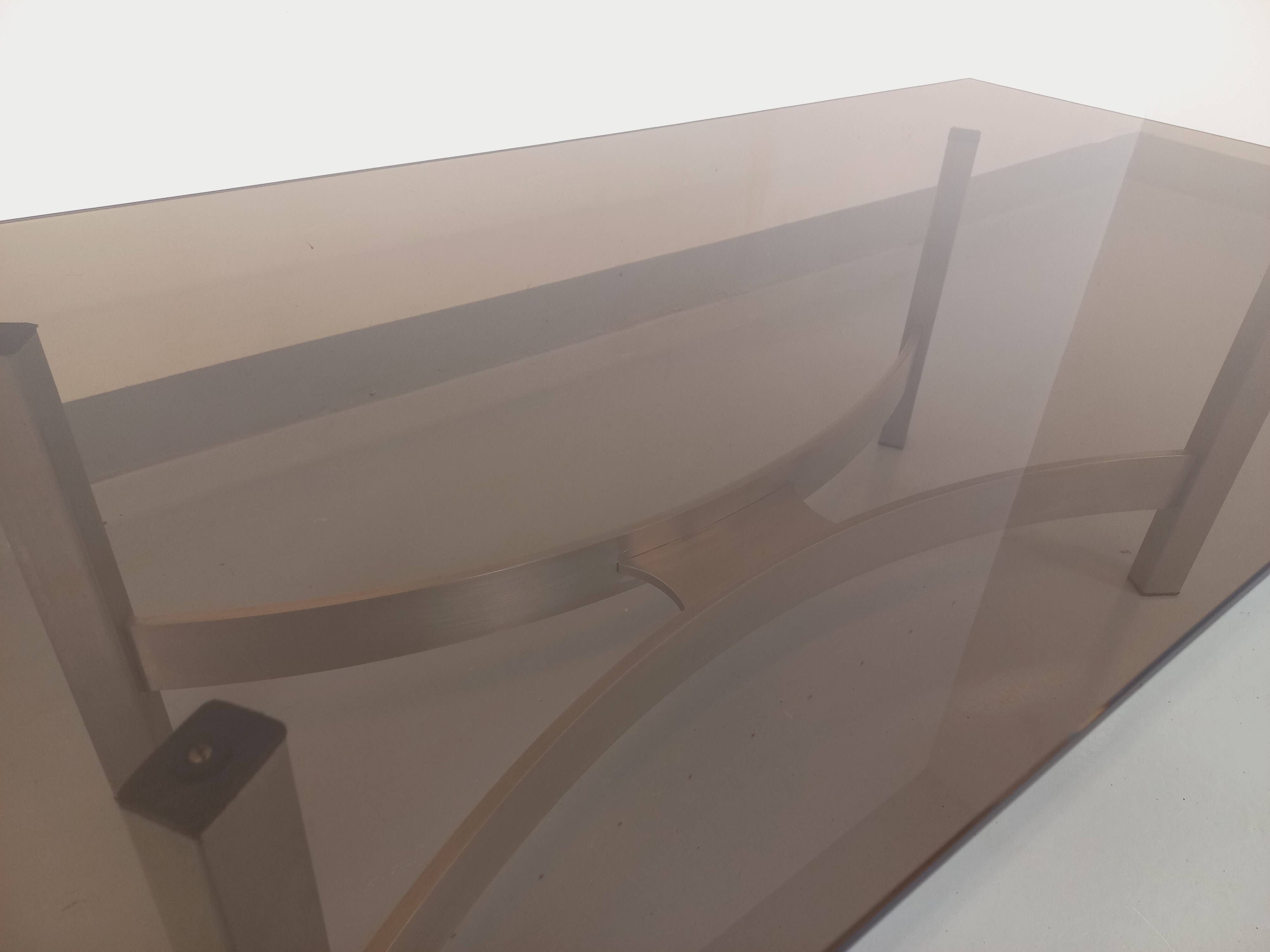 Vintage coffee table in smoked glass and brushed cast aluminum from the 70s