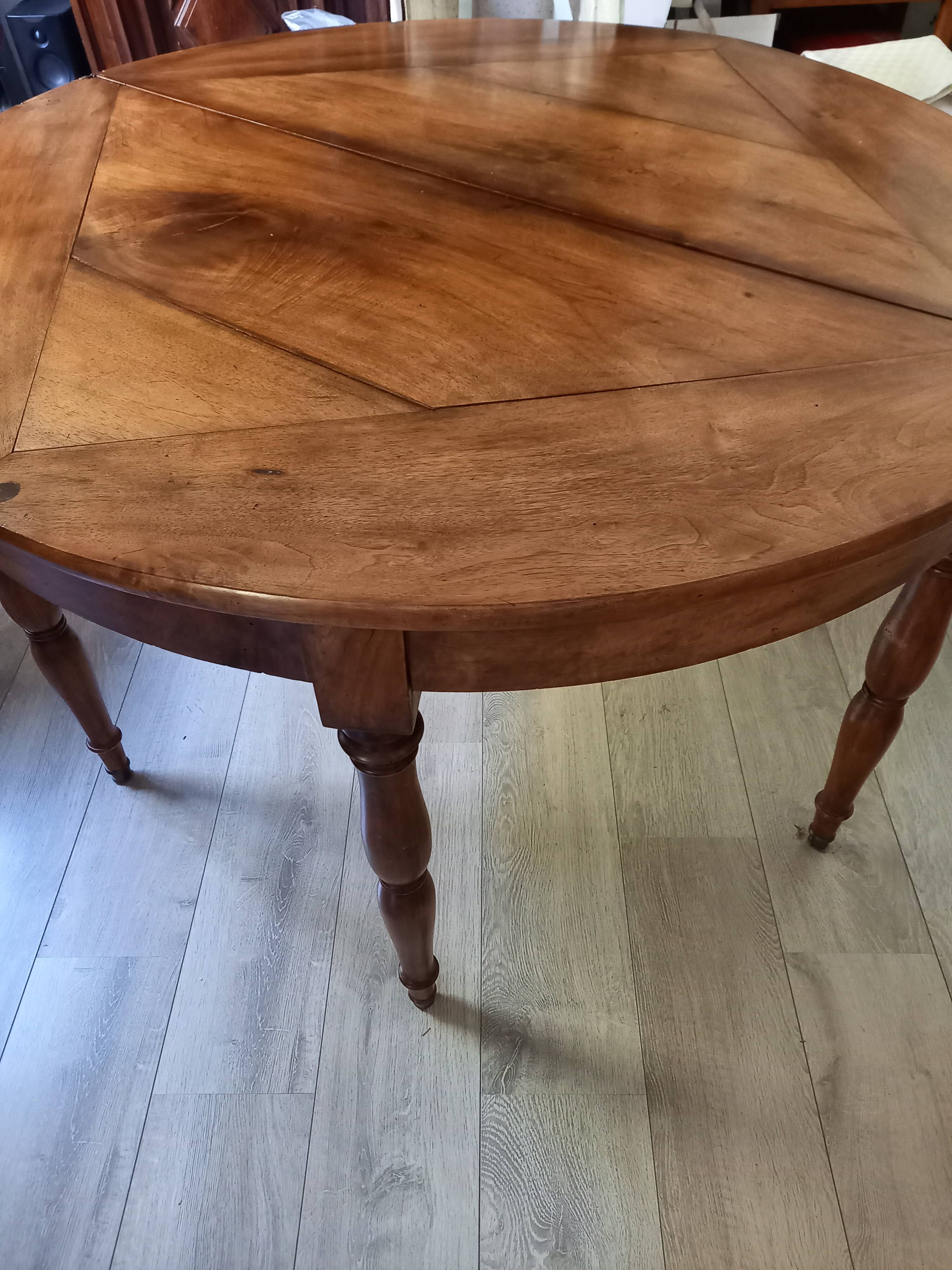 Antique half-moon walnut round table