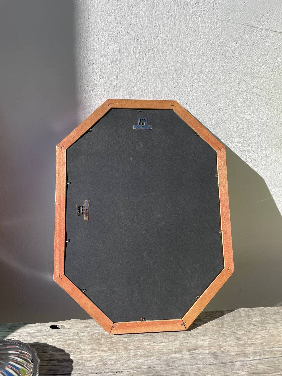 Octagonal beaded wooden mirror