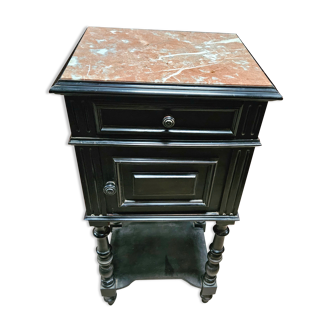 Old bedside table in blackened wood marble top