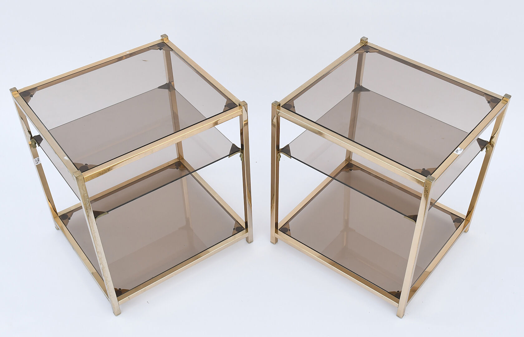 Pair of sofa tips in gilded metal and glass