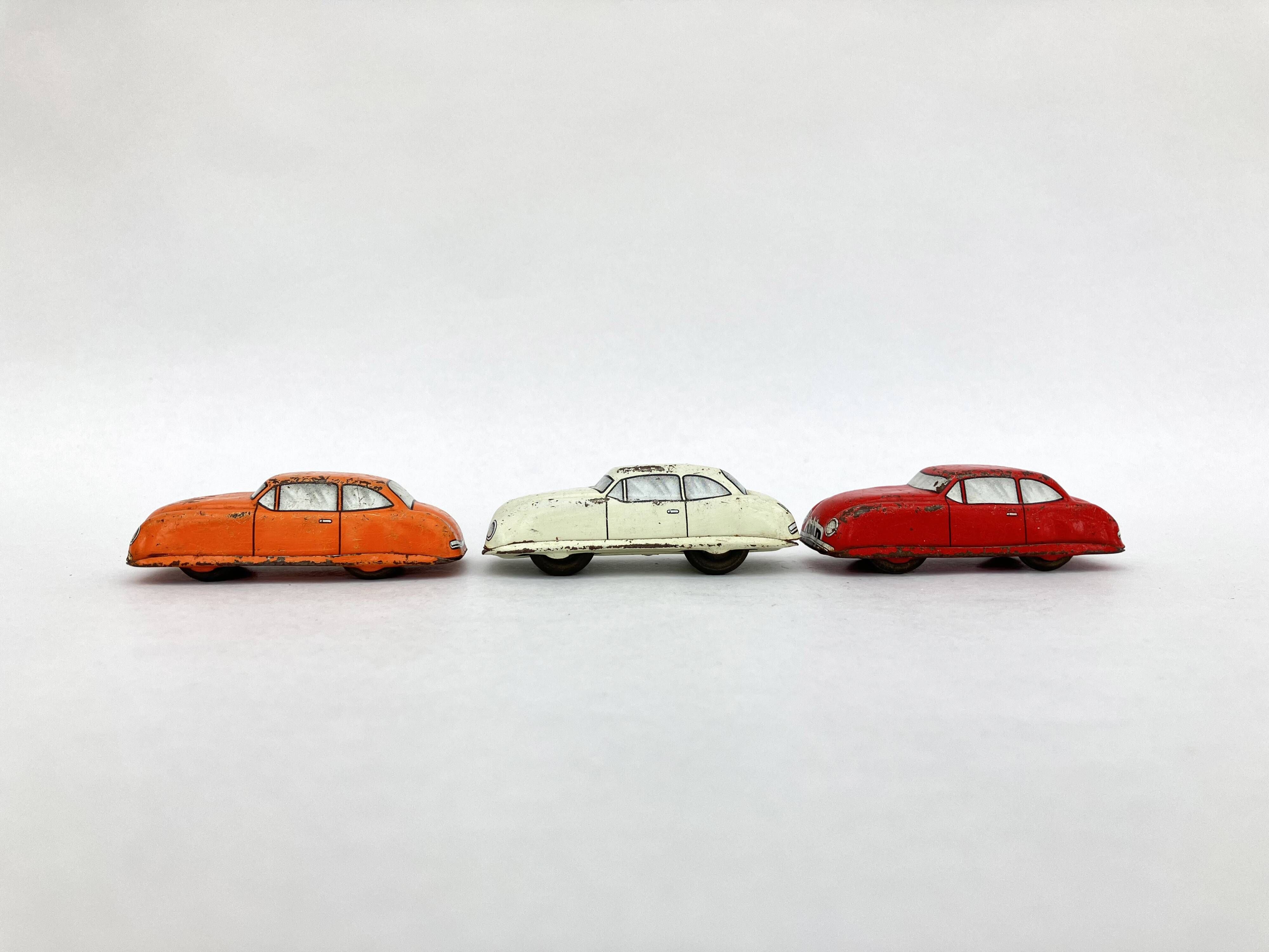 3 old small tin circuit cars with lead wheels • Vintage • 1960s