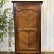 Louis XV bonnetière in cherry wood, early 19th century.