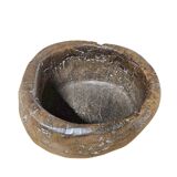 A substantial hand-hewn wooden bowl carved from a single burl section