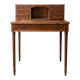 Small vintage wooden desk with a riser.