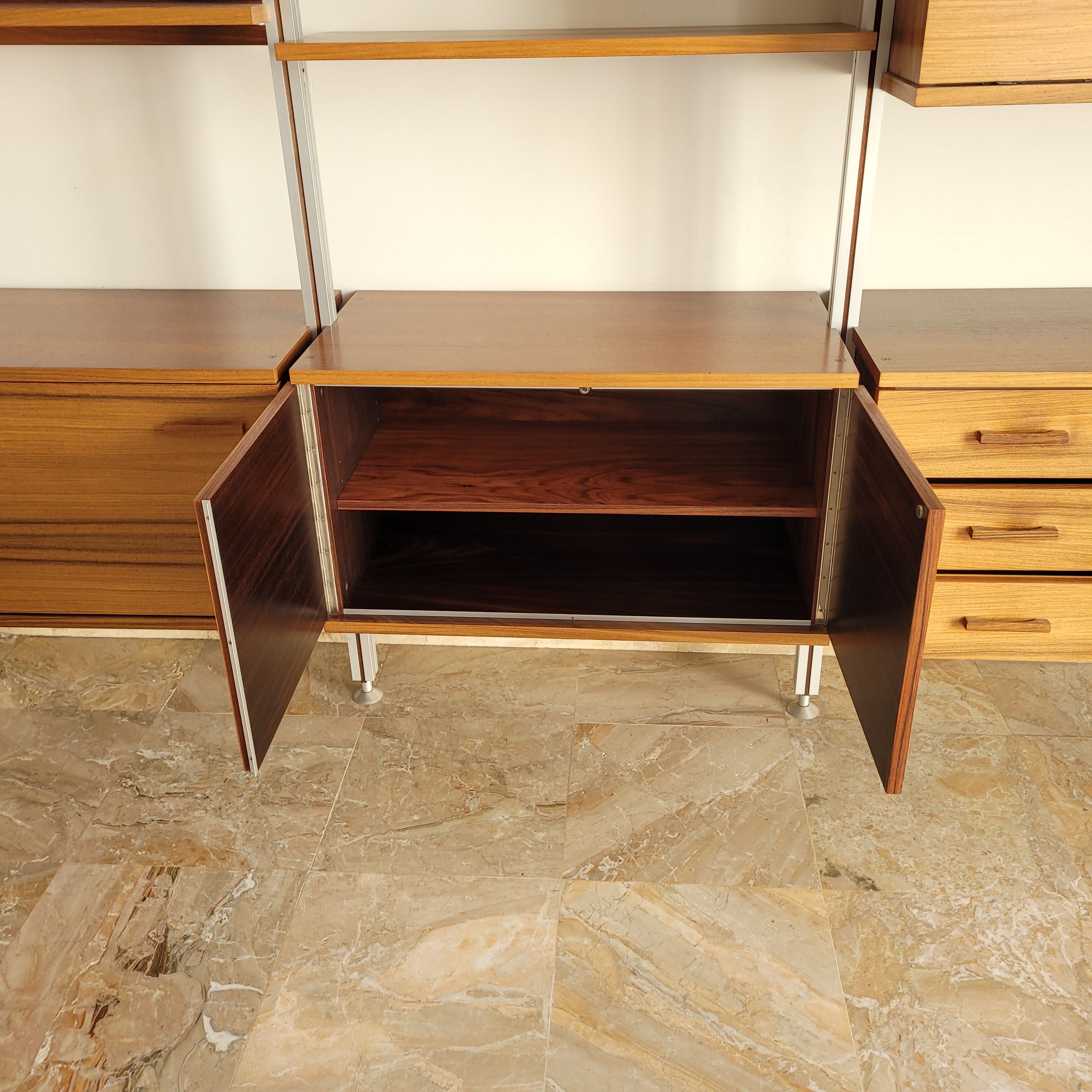 Large Scandinavian wall-mounted wood and aluminum bookcase circa 1960