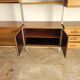 Large Scandinavian wall-mounted wood and aluminum bookcase circa 1960