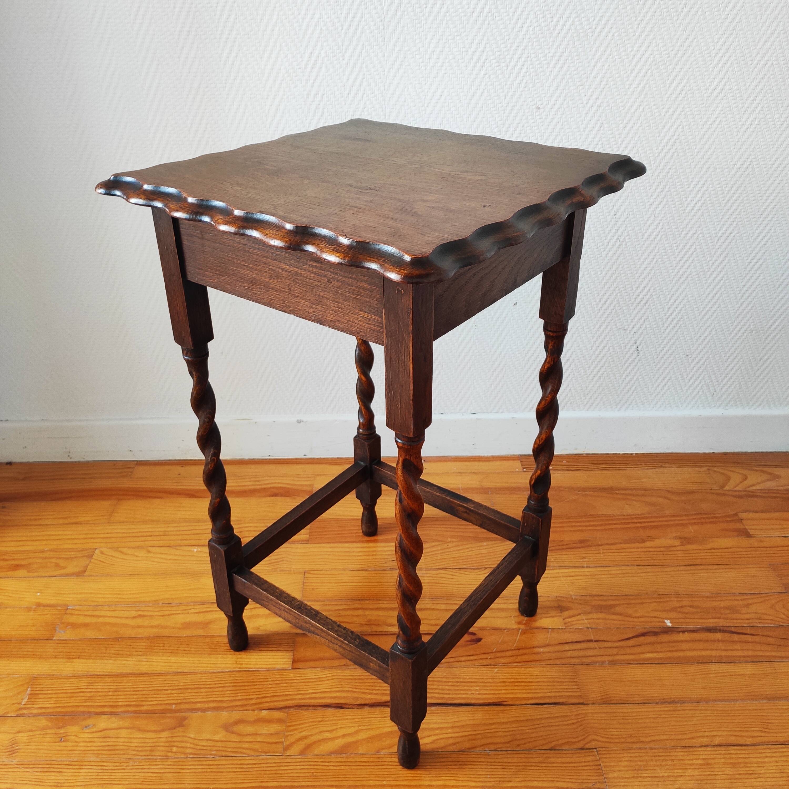 Antique solid oak side table with turned wooden legs.