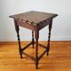 Antique solid oak side table with turned wooden legs.