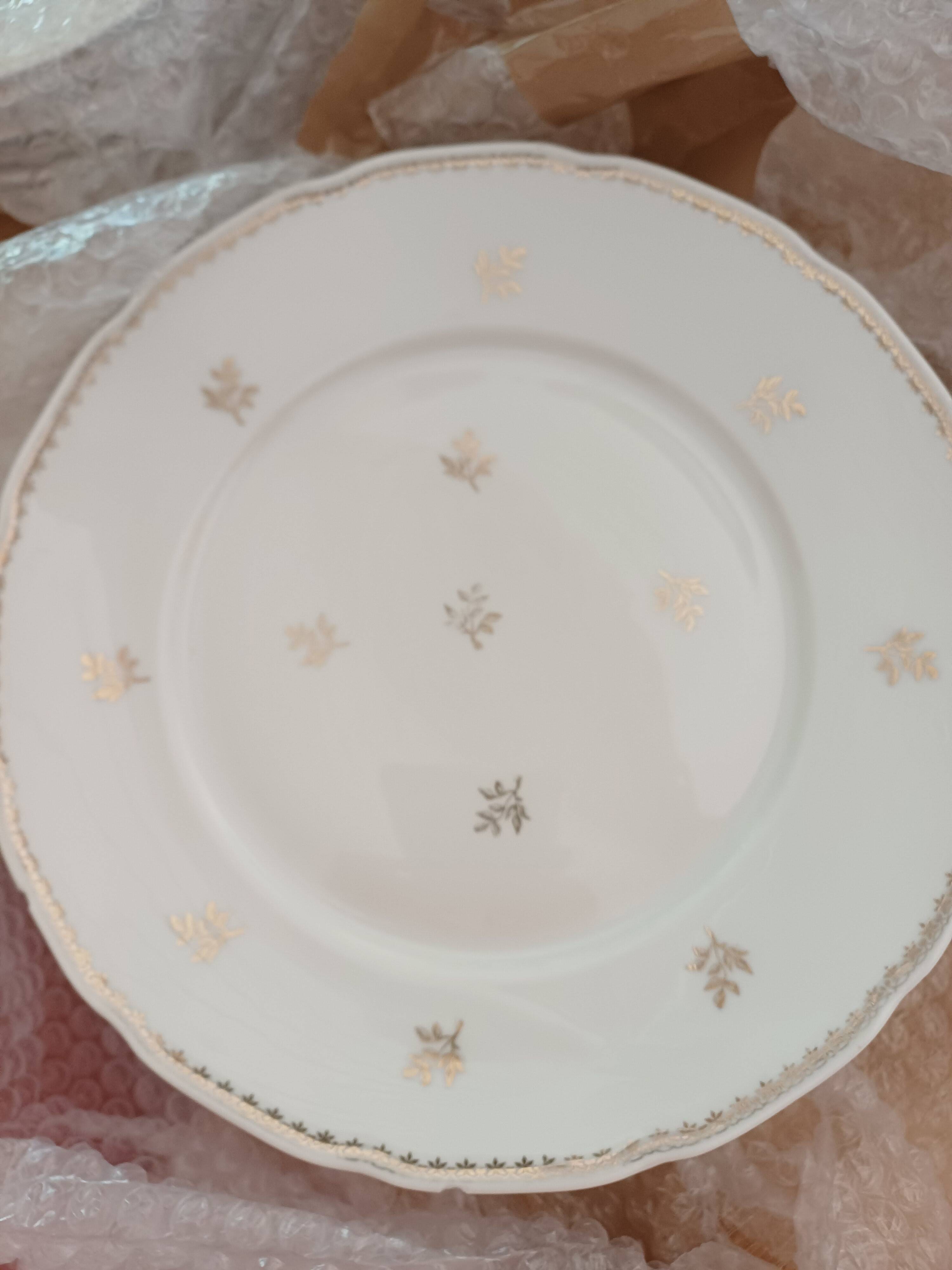 A lot of old white and gold porcelain plates T de F.