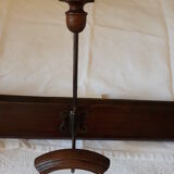 old wall coat holder made up of 3 wooden and metal pads.
