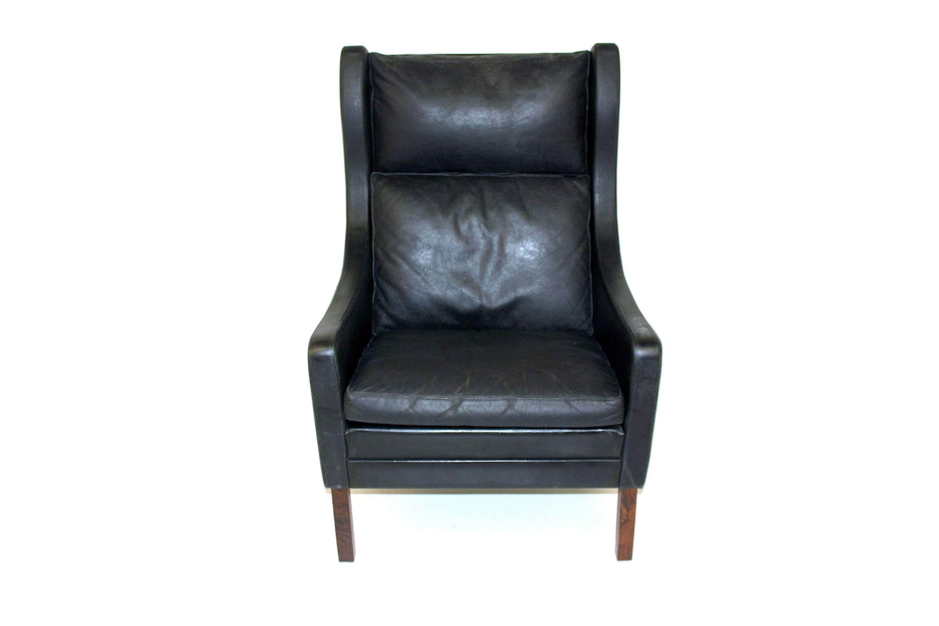 Fauteuil en cuir et palissandre Danemark 1960