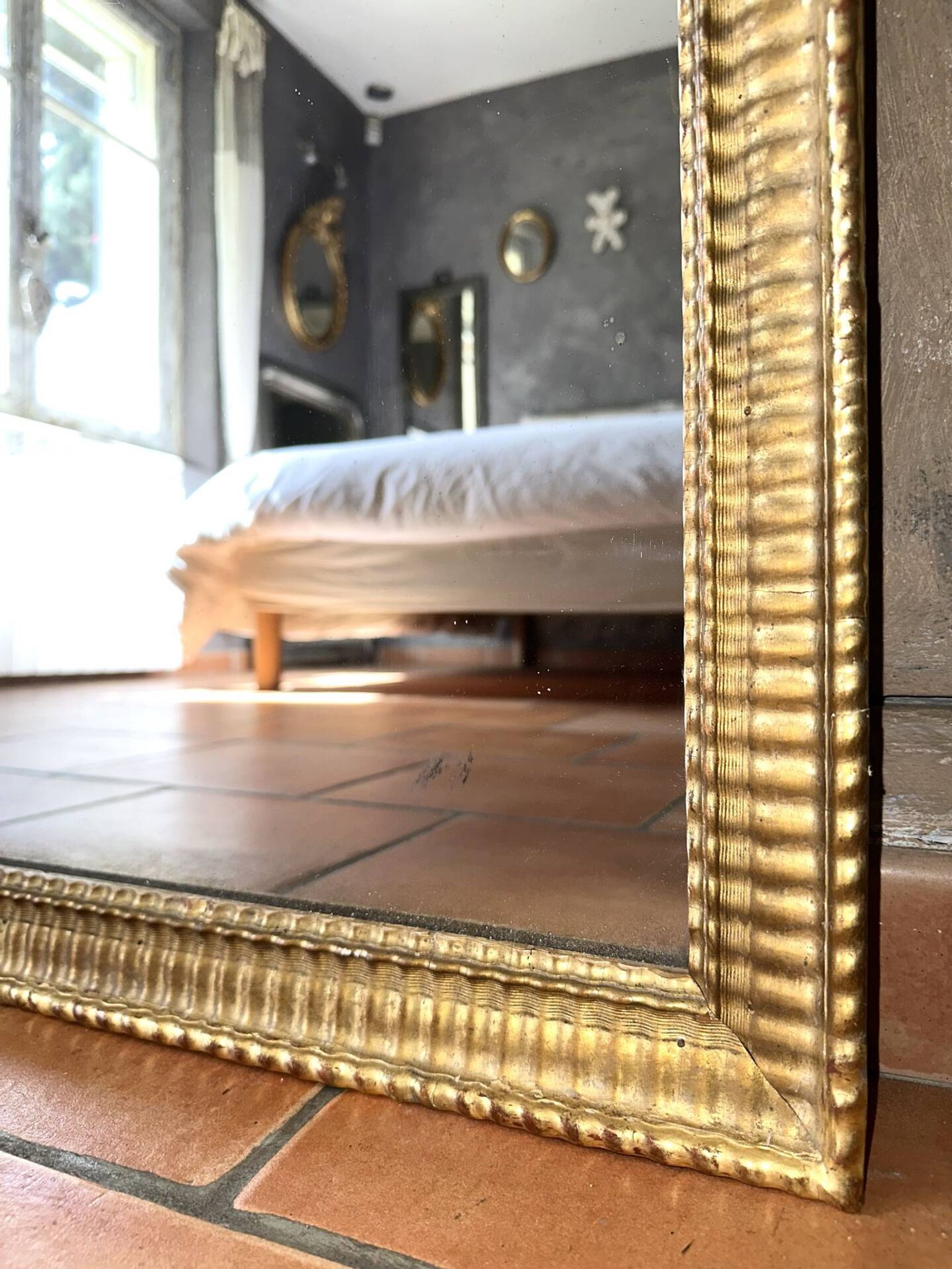 Antique Napoleon III gilded mirror from the 19th century.