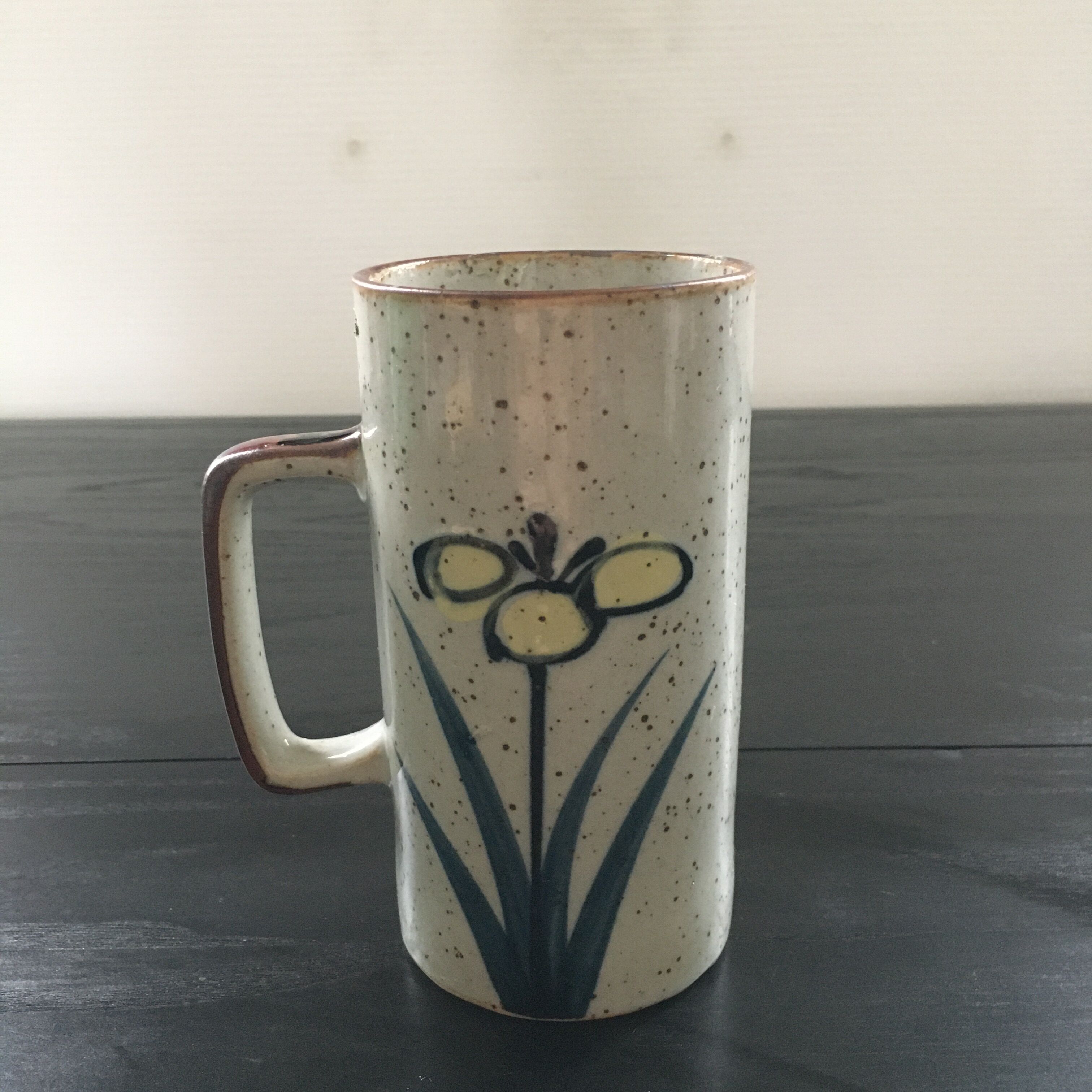 Stoneware mug with floral decoration