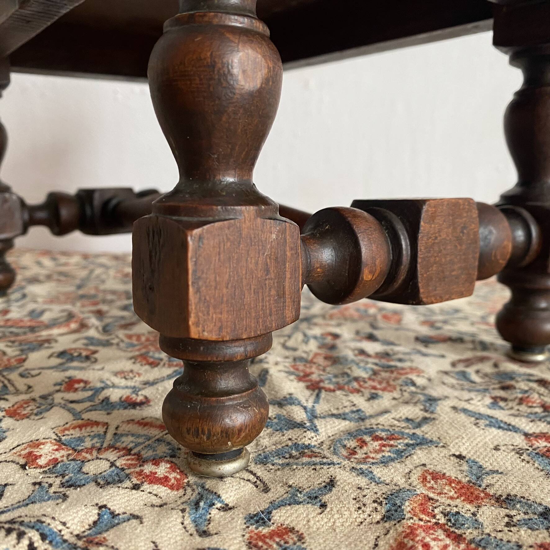 Low stool in carved wood