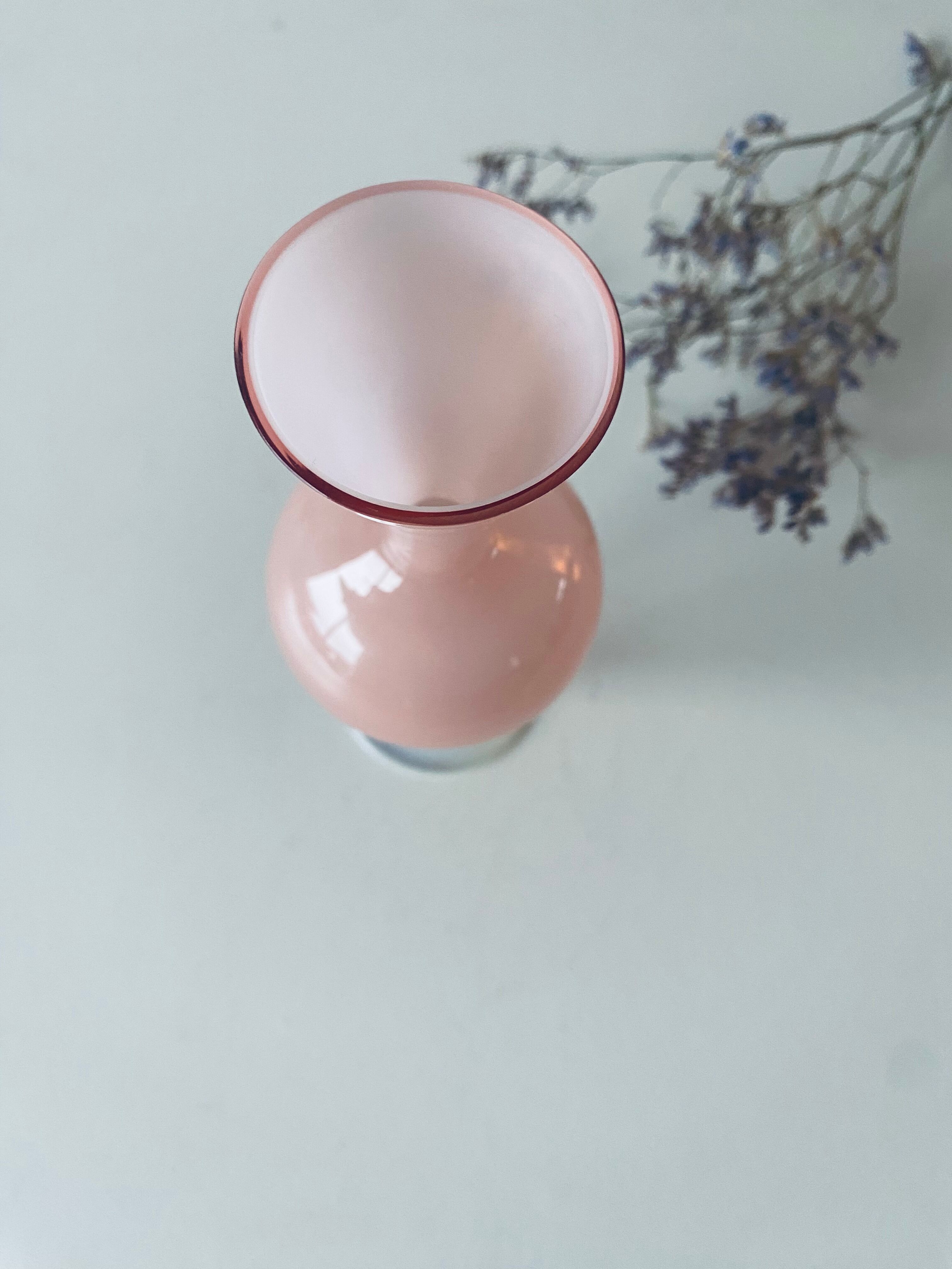 Old vase in pink opaline