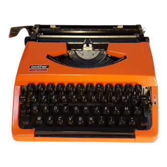 Brother 210 orange mechanical typewriter with carrying lid - vintage