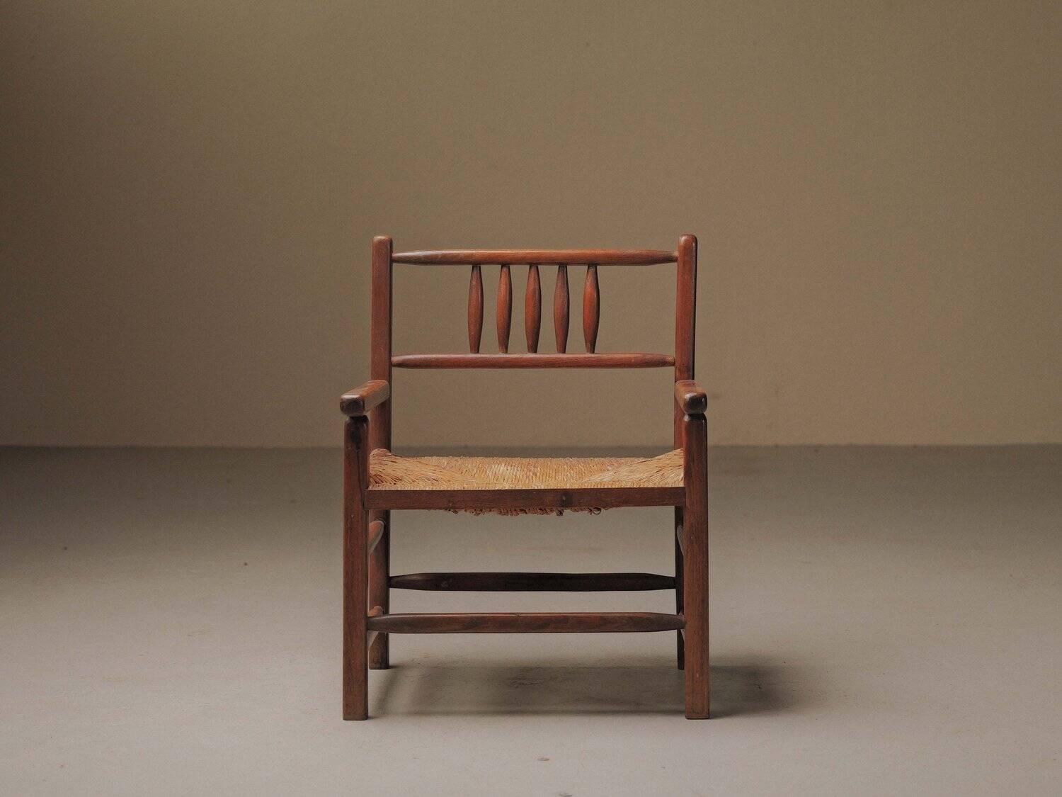 Wicker armchair in solid wood, handcrafted, France, around 1950.