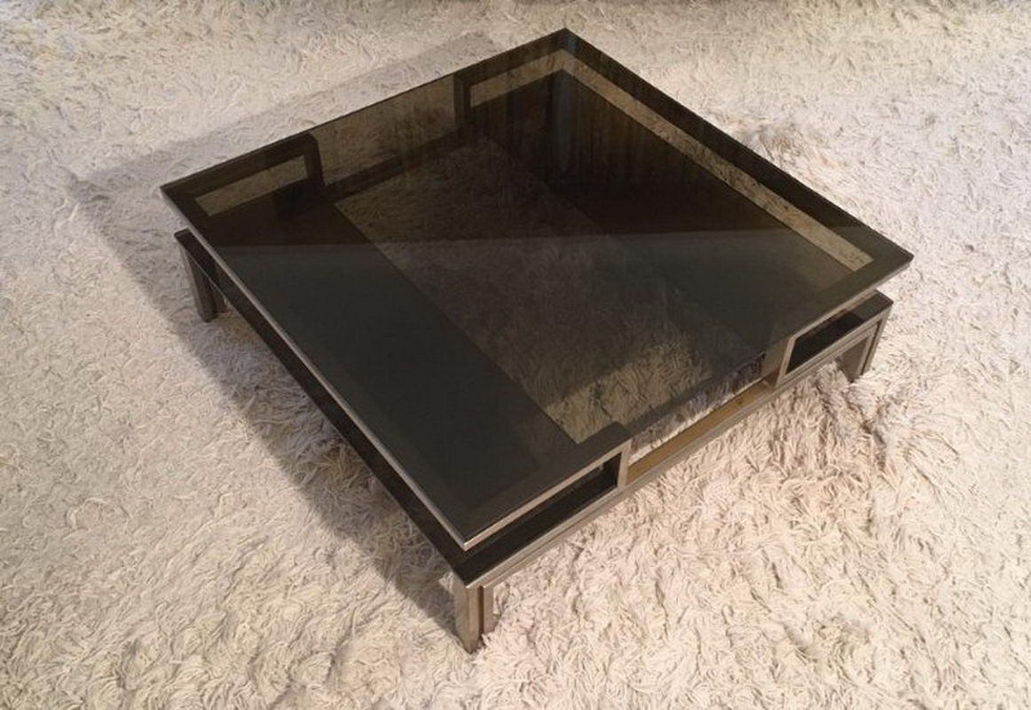 Very nice coffee table in brushed steel and brass