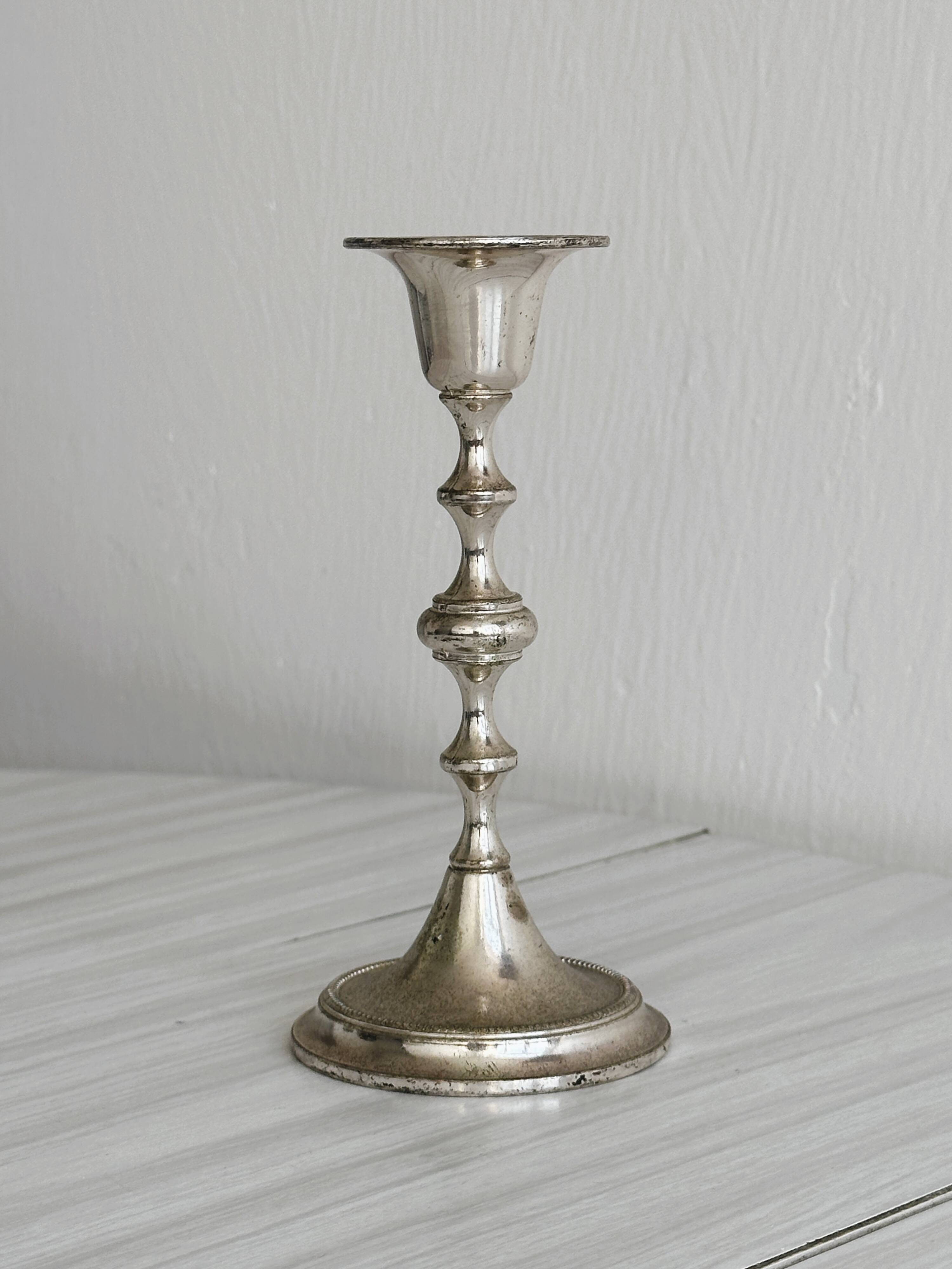 Small patinated candle holder.