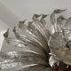 Silver wrought iron sunburst wall light from the 1960s.