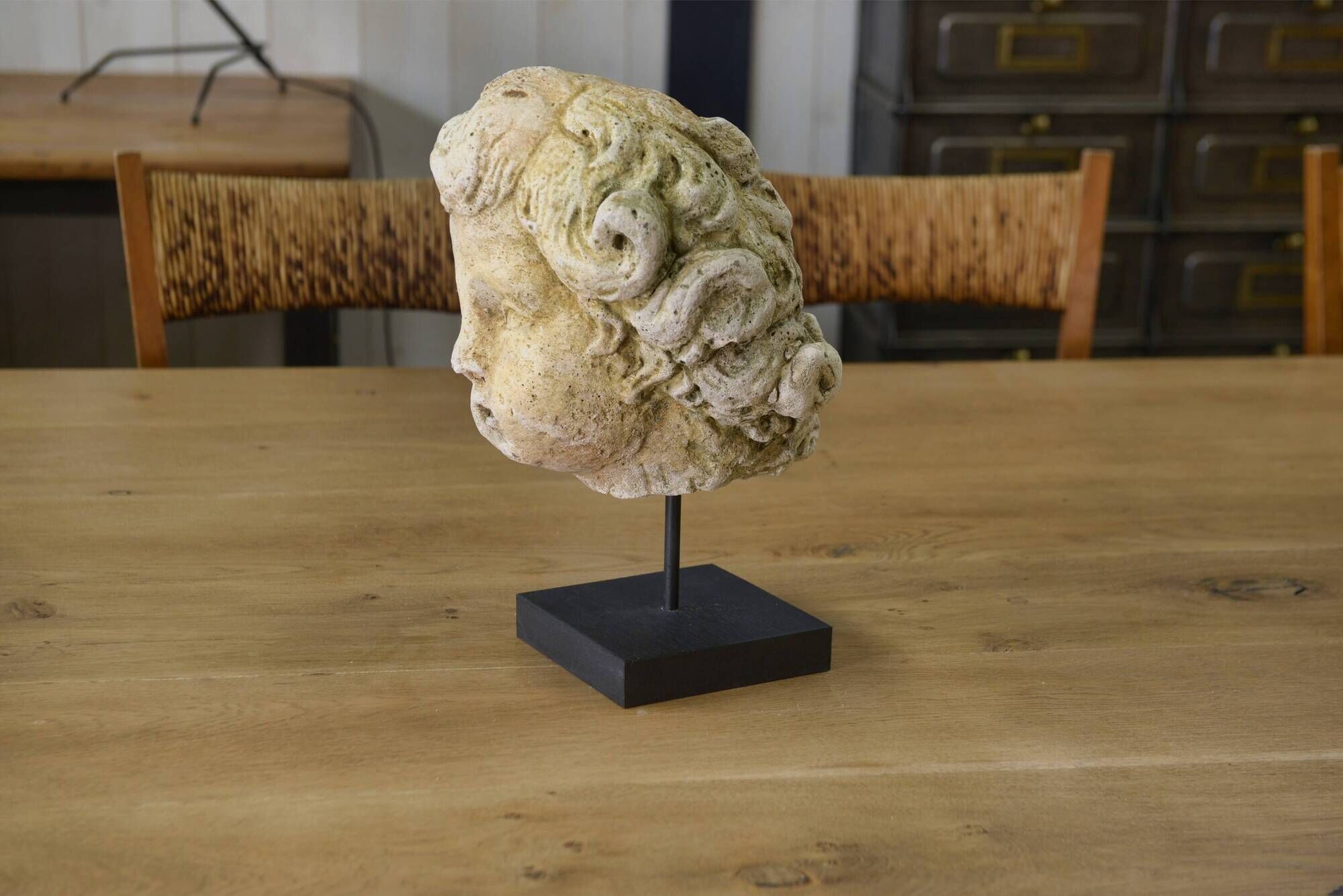 Reconstituted stone sculpture in antique style from the 20th century.