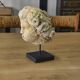 Reconstituted stone sculpture in antique style from the 20th century.