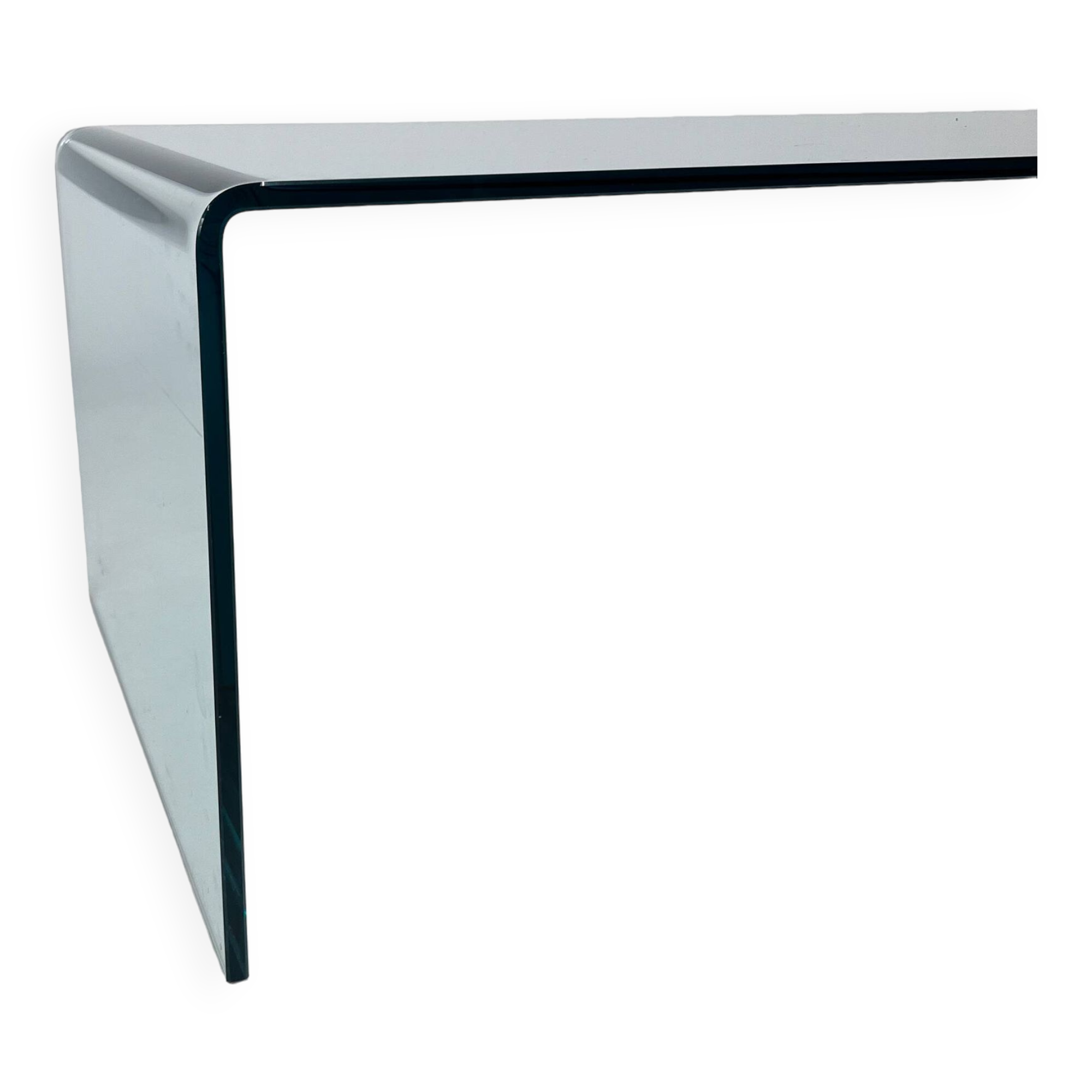 Postmodern coffee table made entirely of glass. Modernist and bitches minimalist look.