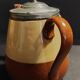 Beige and brown earthenware teapot with pewter lid, early 20th century