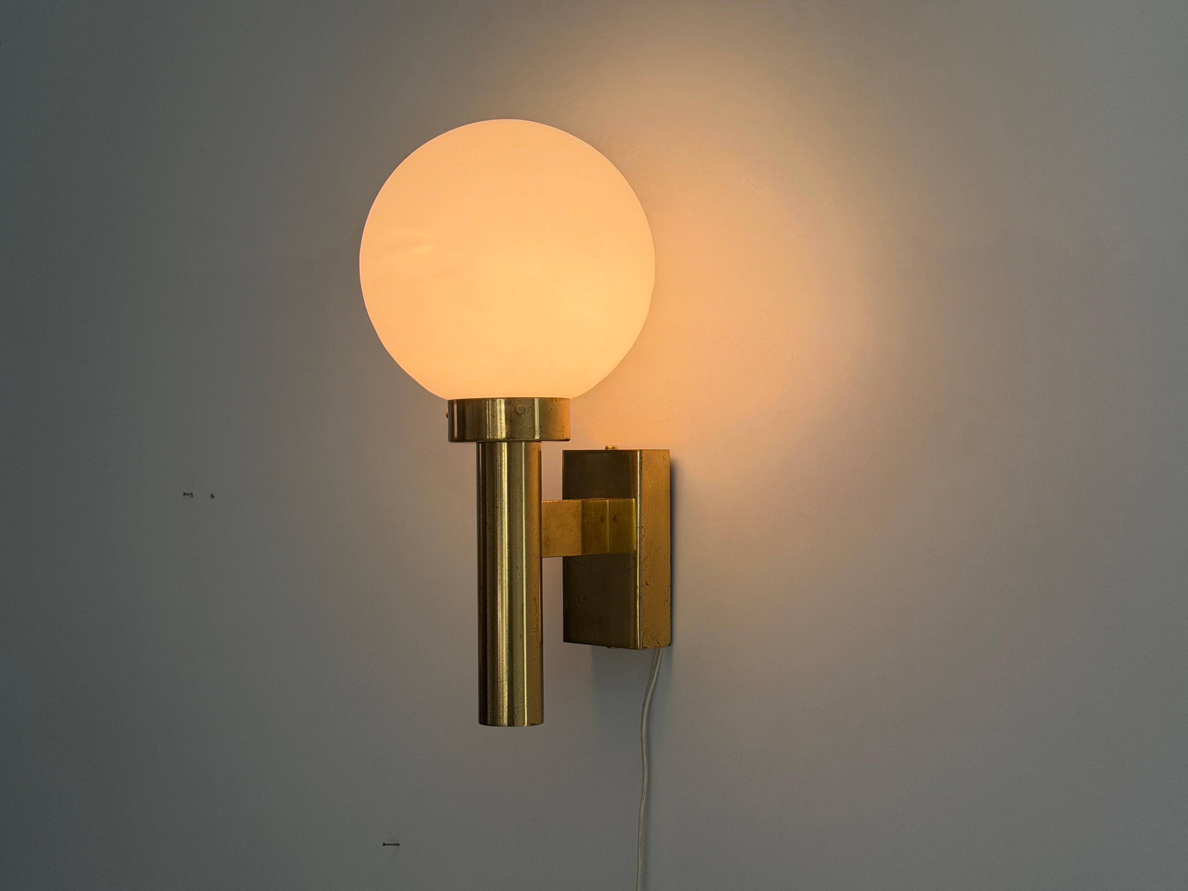 Large minimalist cinema wall light in opal glass and heavy brass, 1960s, Germany