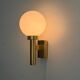 Large minimalist cinema wall light in opal glass and heavy brass, 1960s, Germany