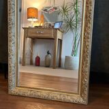 Gilded mirror with antique wood and stucco frame