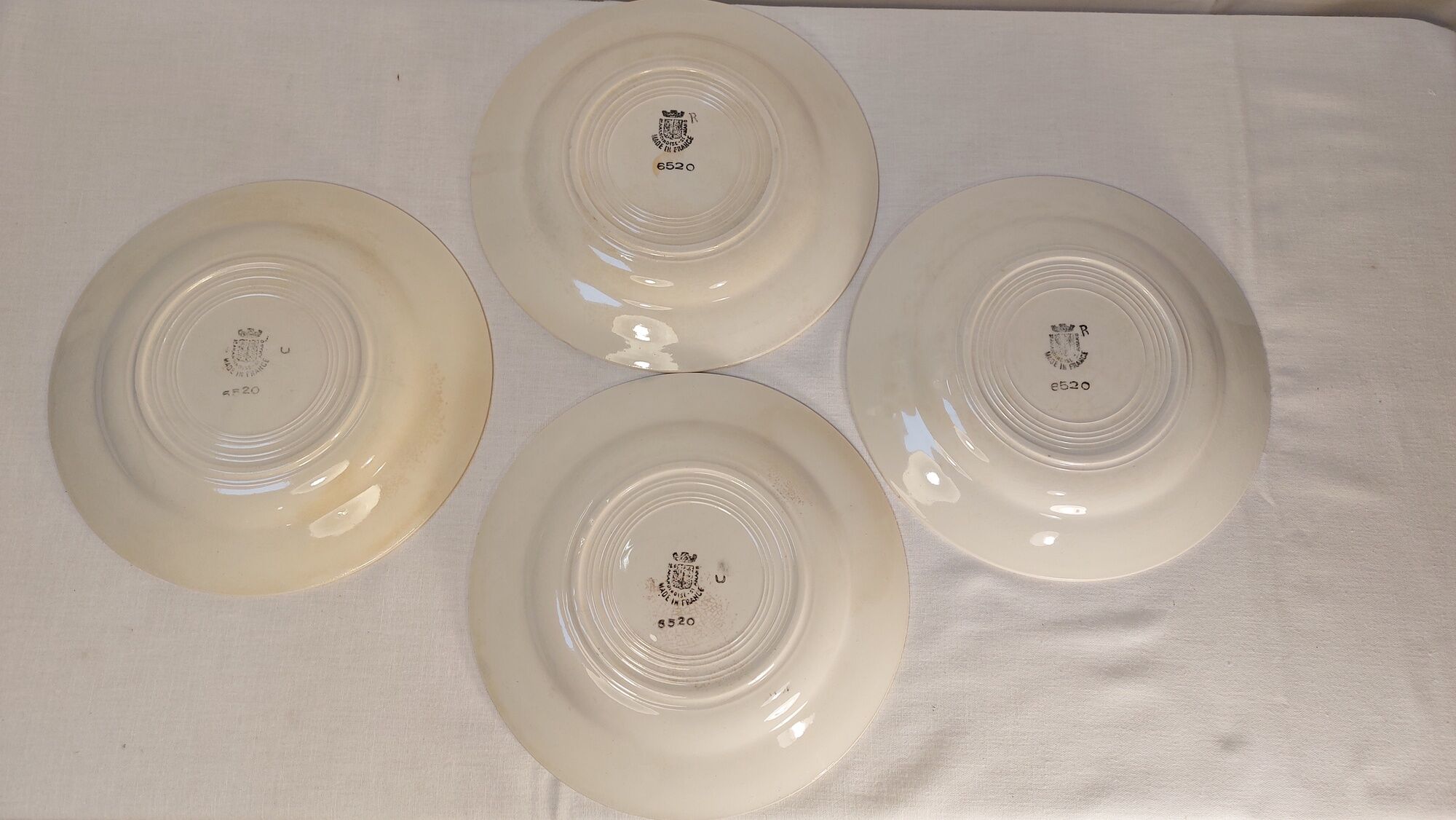 Set of 4 old flat plates from the earthenware factories of St Amand
