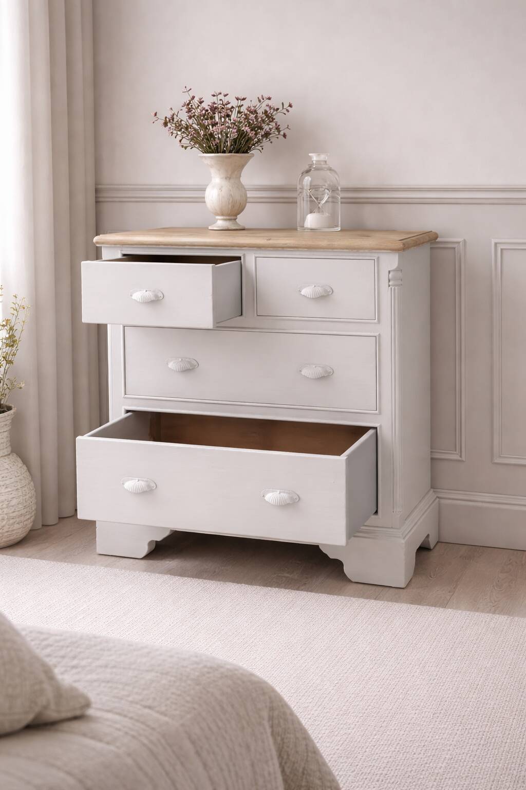 English commode of beautiful craftsmanship enhanced in pearl grey with a waxed finish.
