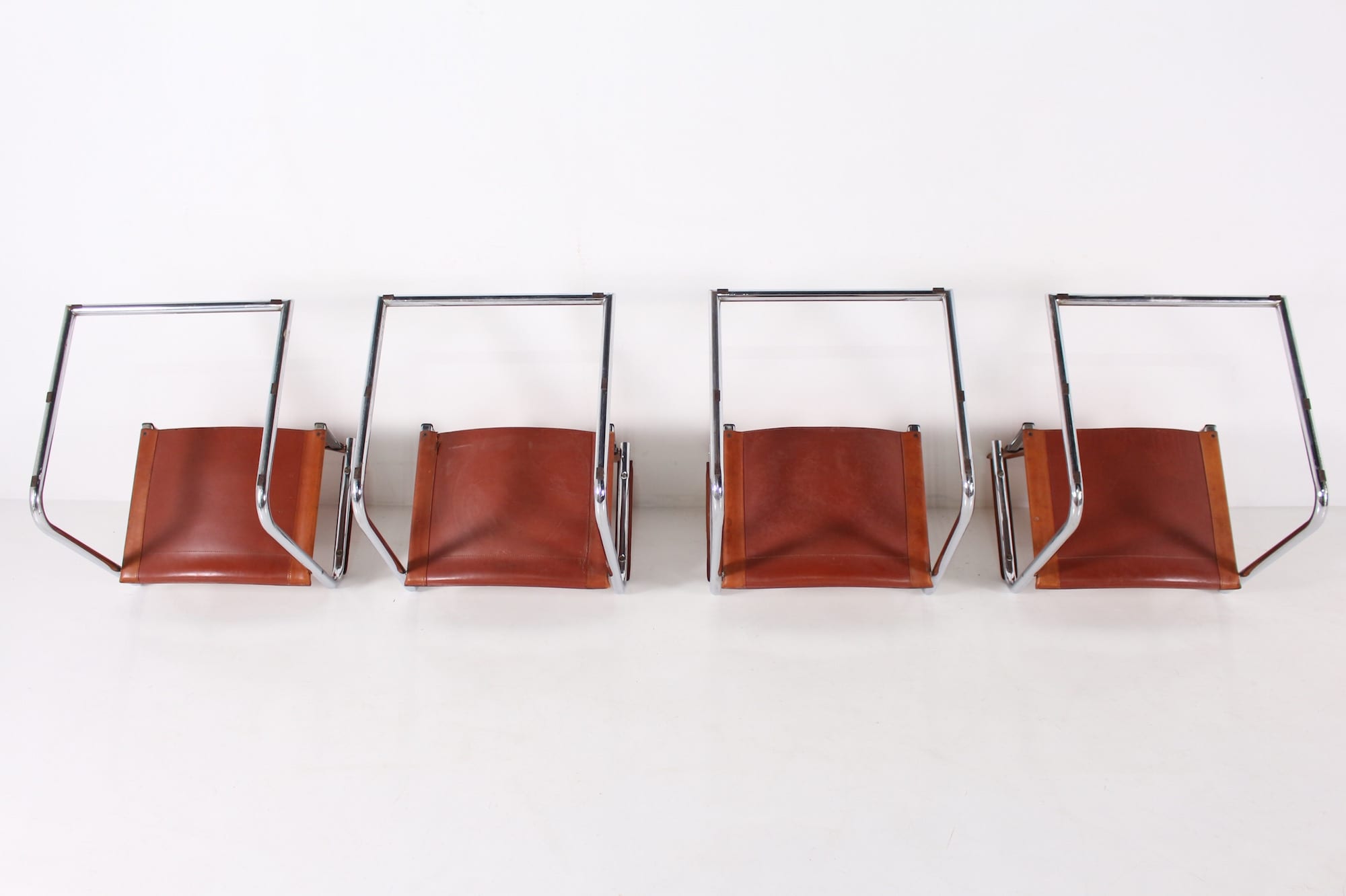 4 Matteo Grassi leather cogna cantilever armchairs