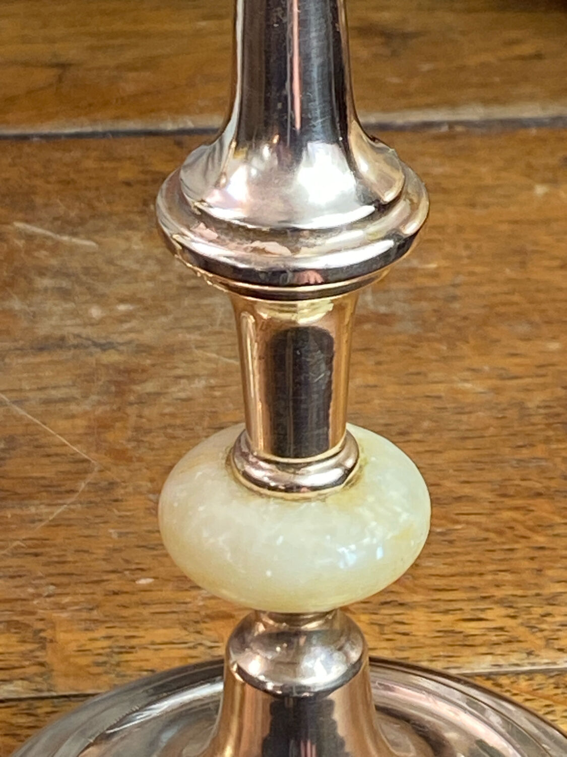 Pair of brass and stone candlesticks