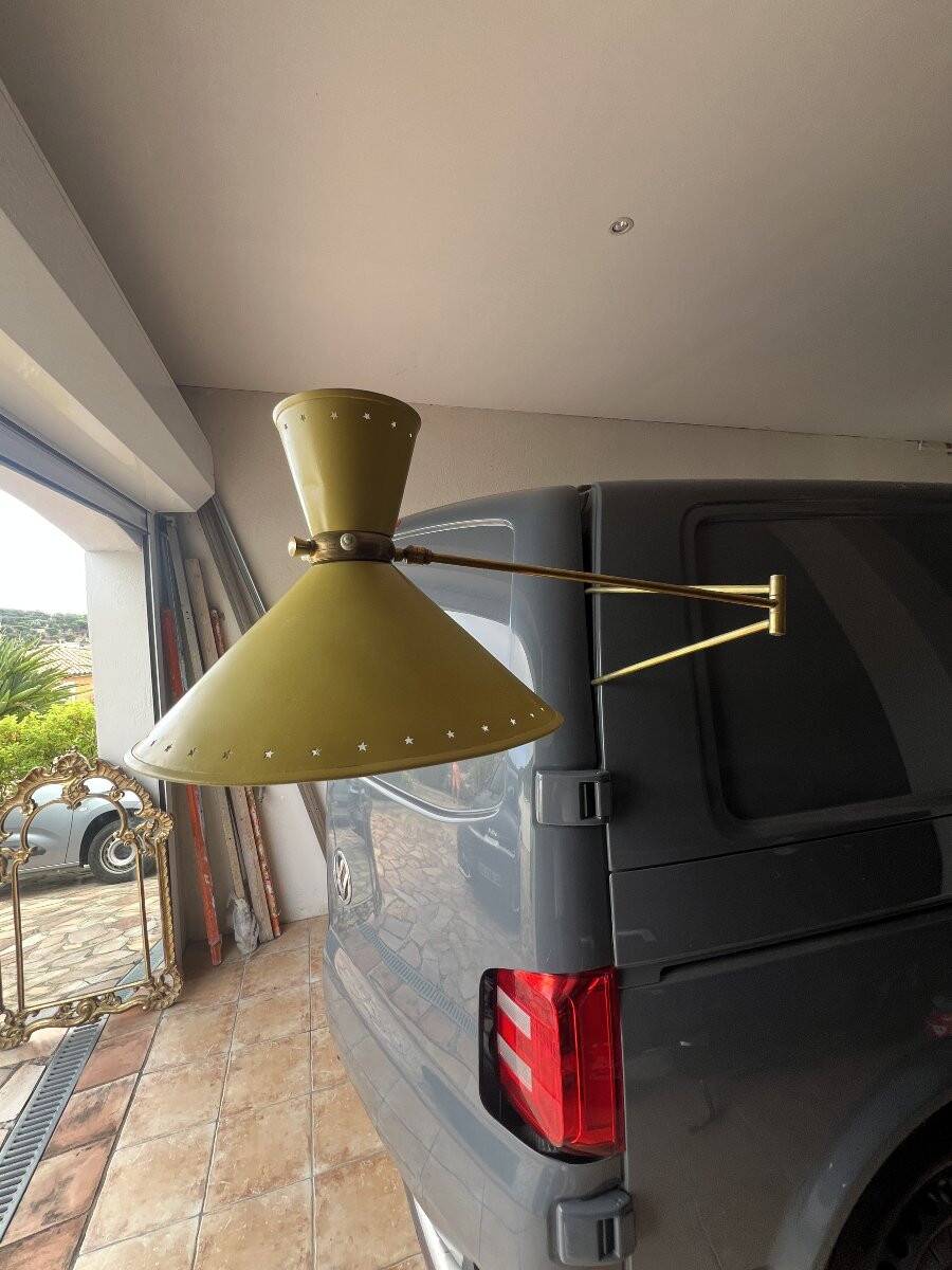 Diabolo wall lamp lunel yellow in the style of René Mathieu Guariche, star sheet metal.