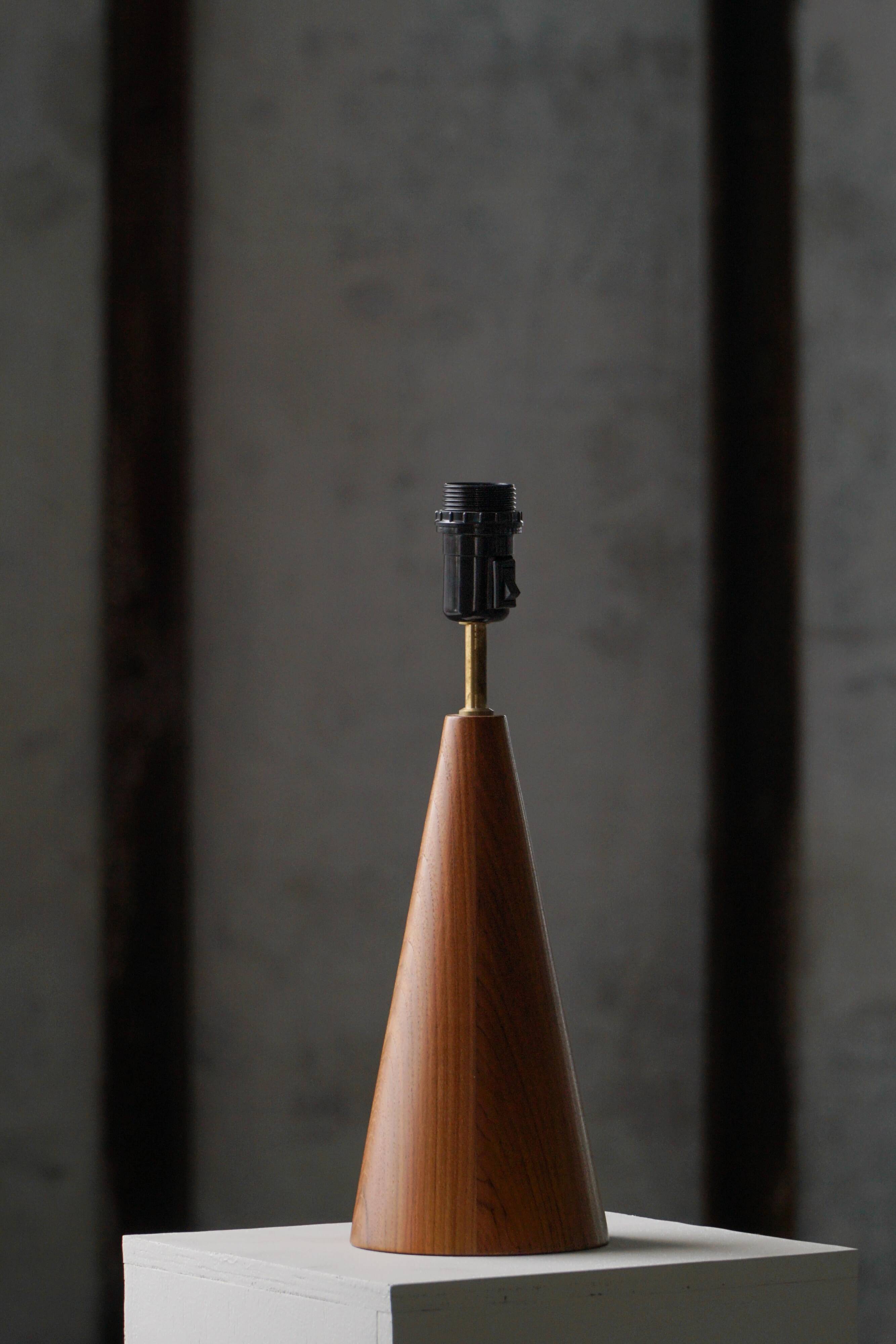 Modern Danish, a conical table lamp in teak, 1980s.